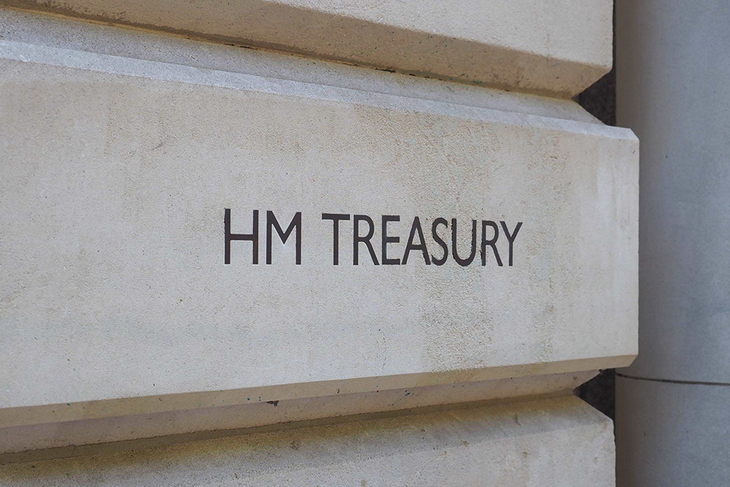 Clear image of the HM Treasury sign on the building, showcasing architecture and official government signage.